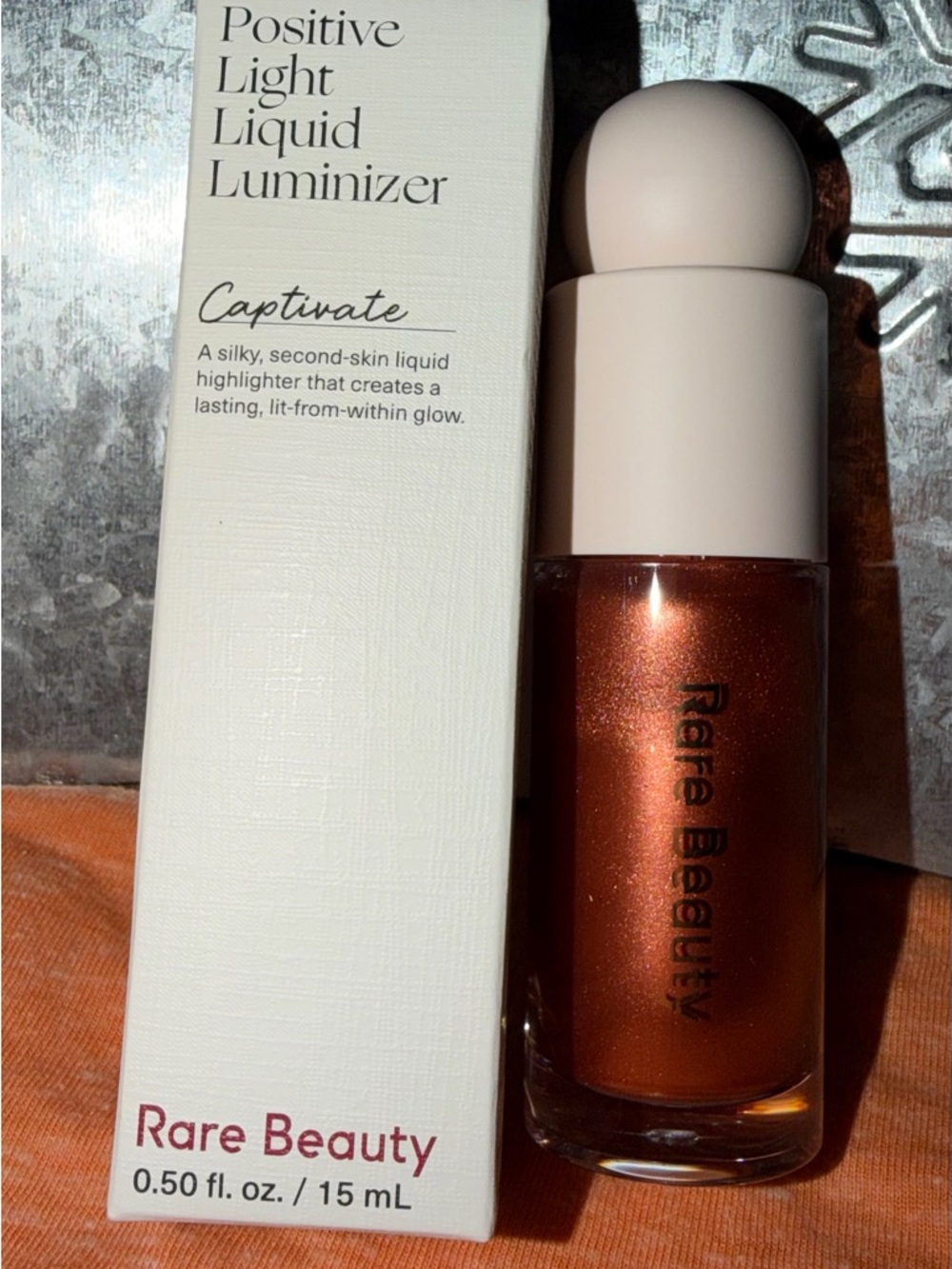 Rare Beauty Positive Light Liquid Luminizer — Captivate (Copper)